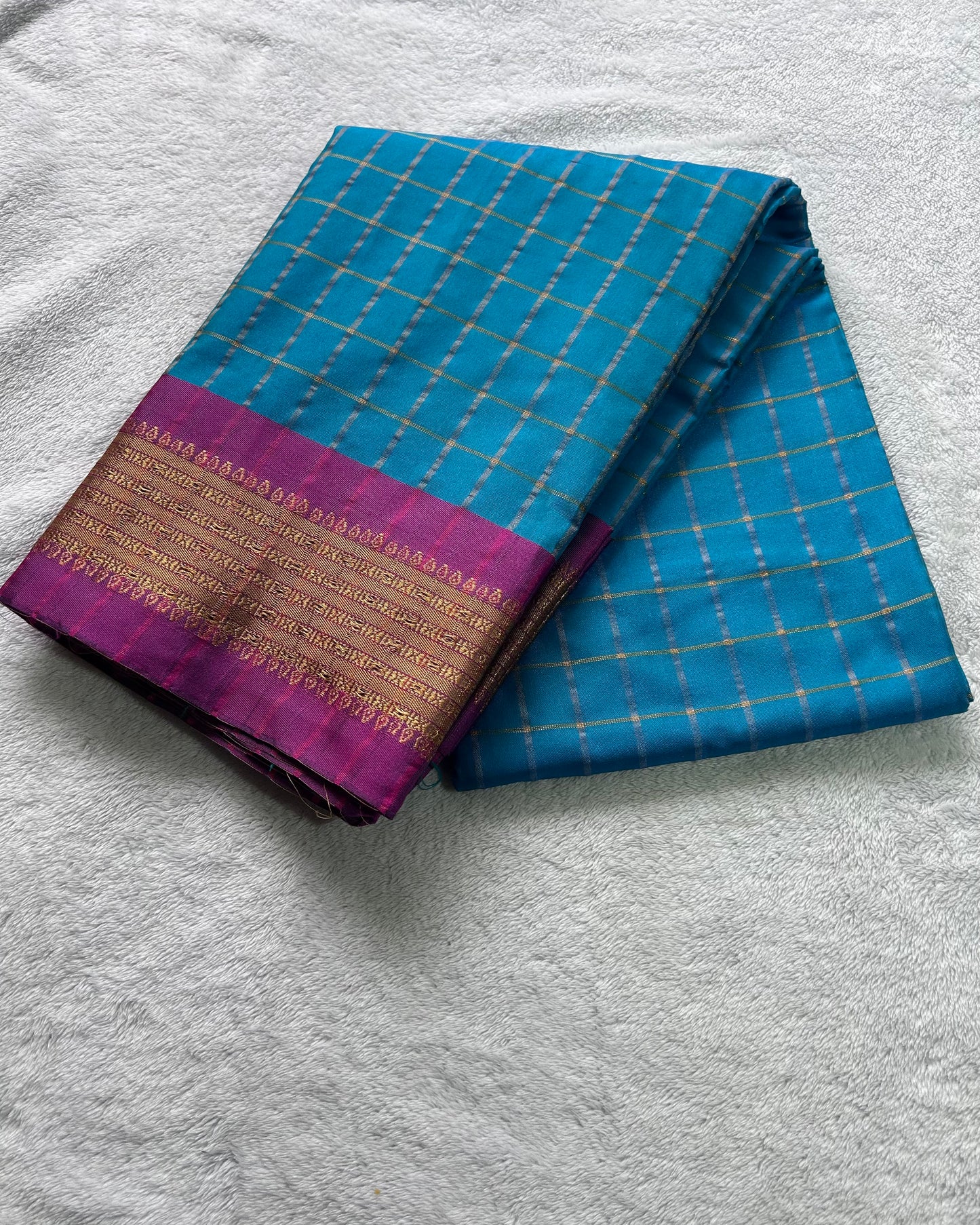 Teal green with checks pattern semi silk saree
