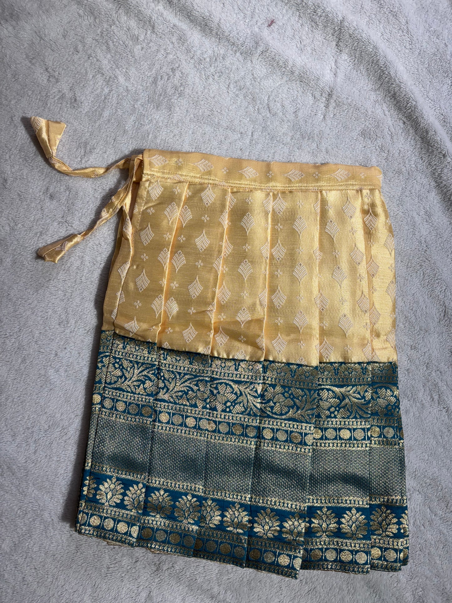 Yellow lehenga with green blouse with handmade aari work all over the blouse