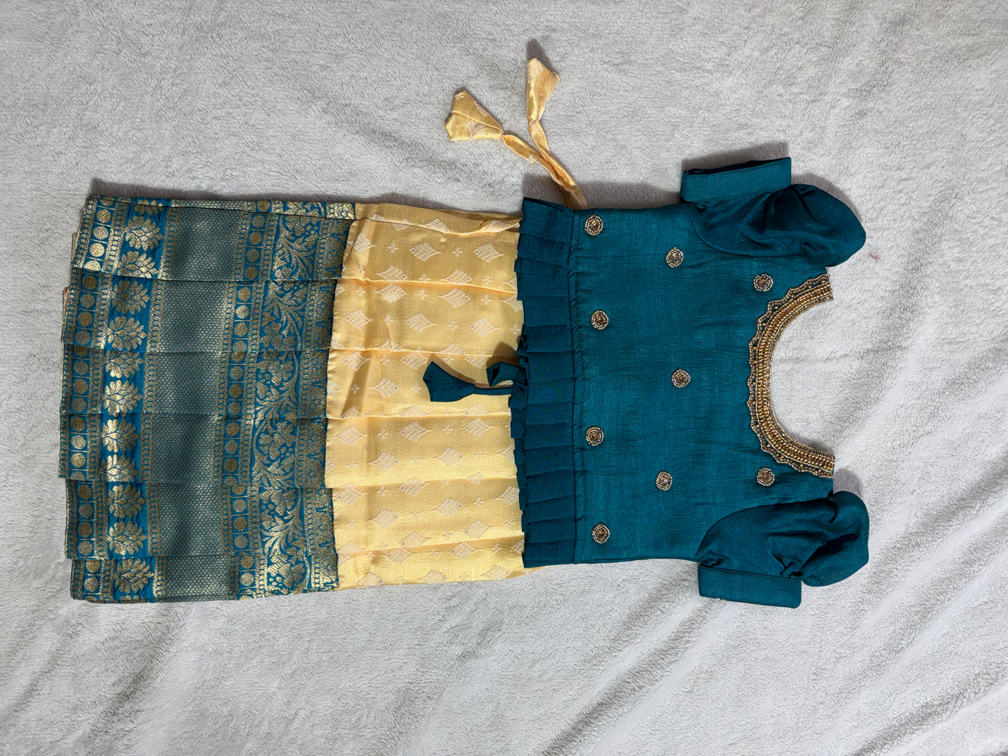 Yellow lehenga with green blouse with handmade aari work all over the blouse