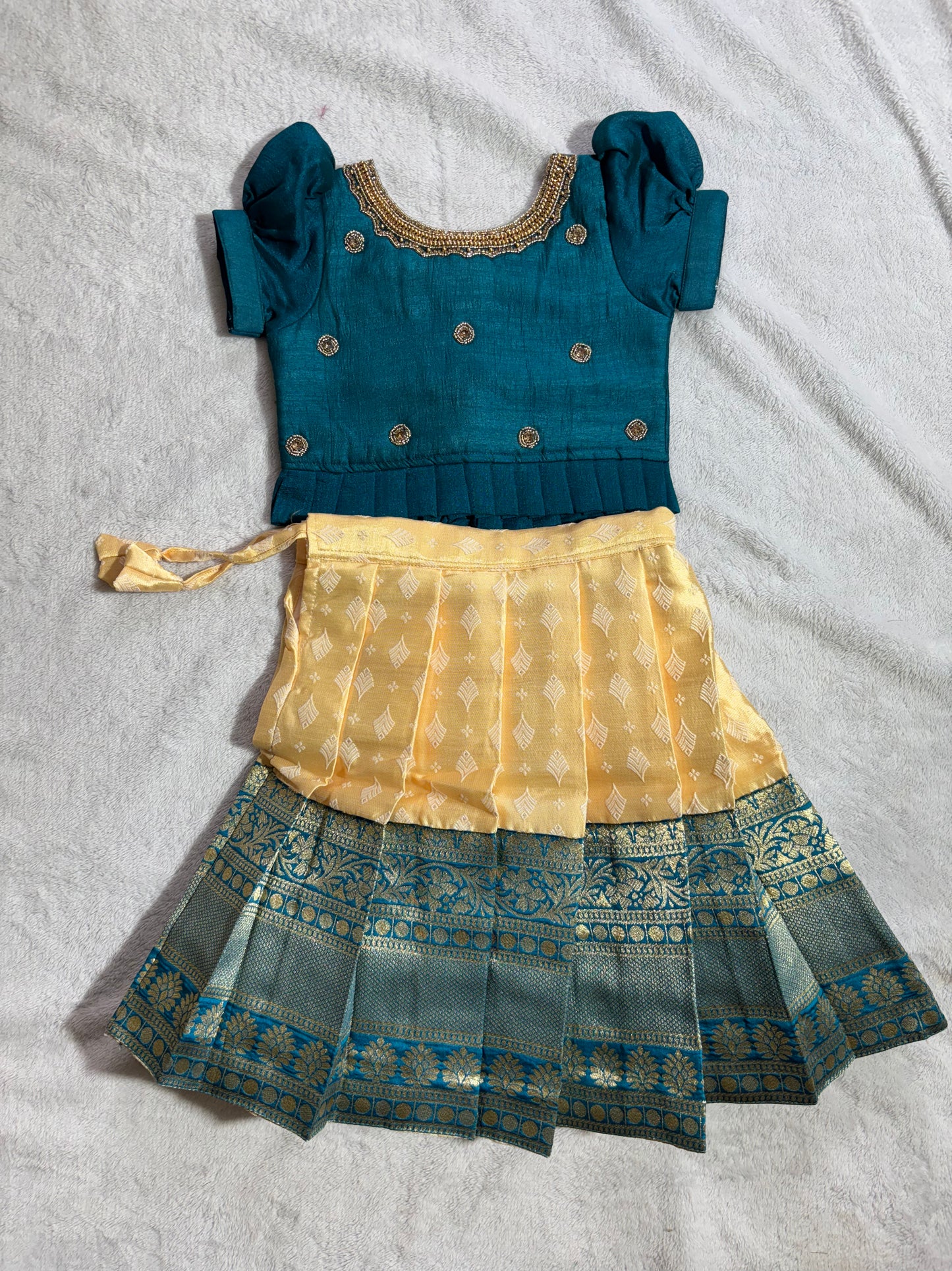 Yellow lehenga with green blouse with handmade aari work all over the blouse