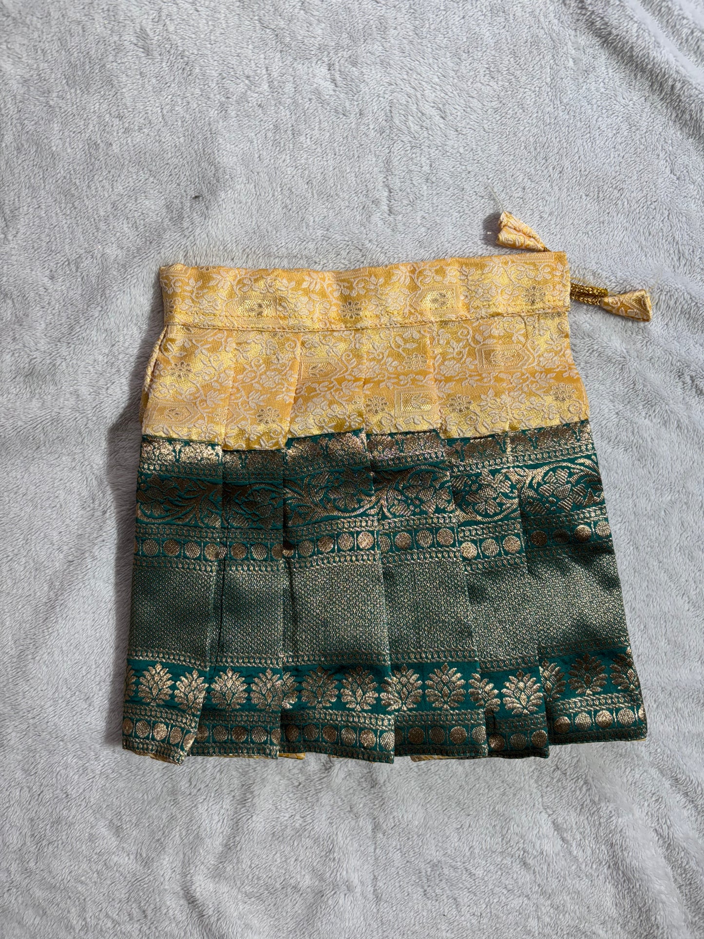 Dark green blouse with yellow lehenga pattu pavadai