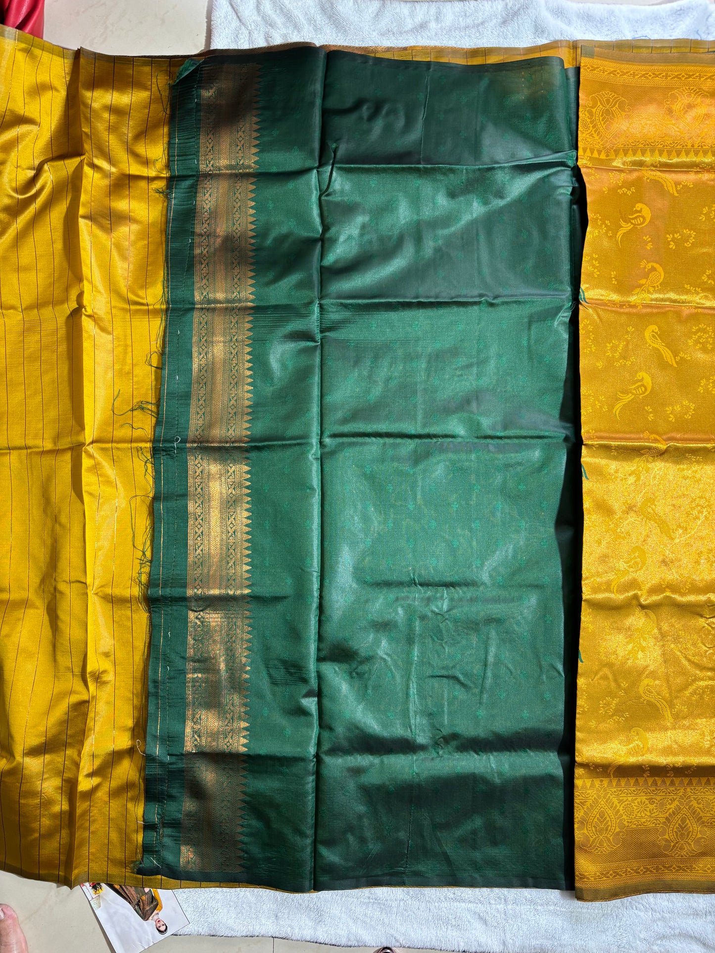 Mustard yellow with contrast dark green semi silk saree