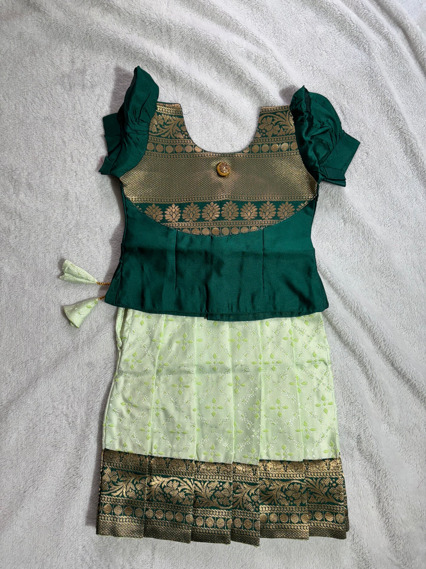 Dark green blouse with pista green lehenga pattu pavadai blouse with