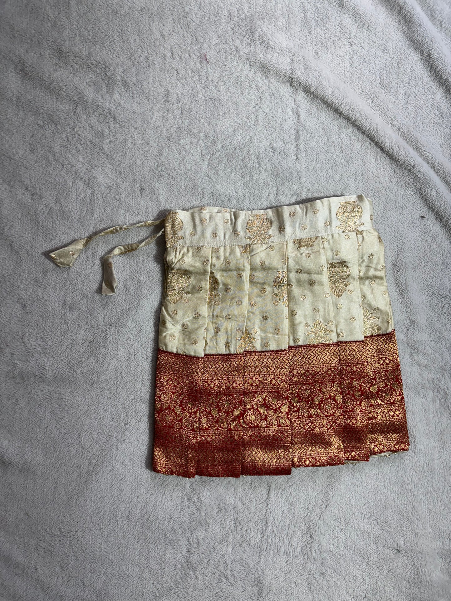 Red and half white pattu pavadai with handmade Ari work all over the jacquard blouse