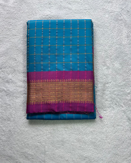 Teal green with checks pattern semi silk saree