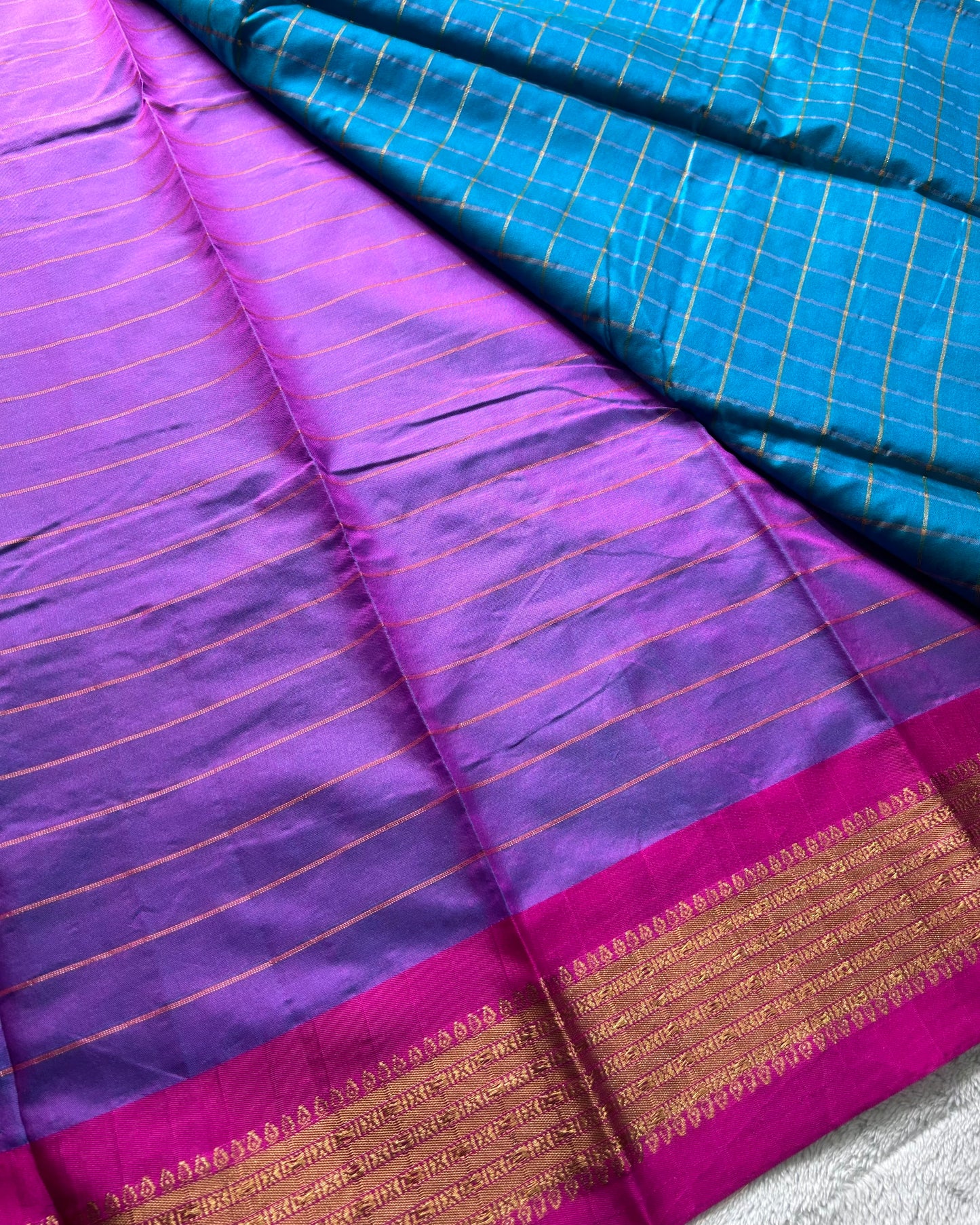 Teal green with checks pattern semi silk saree