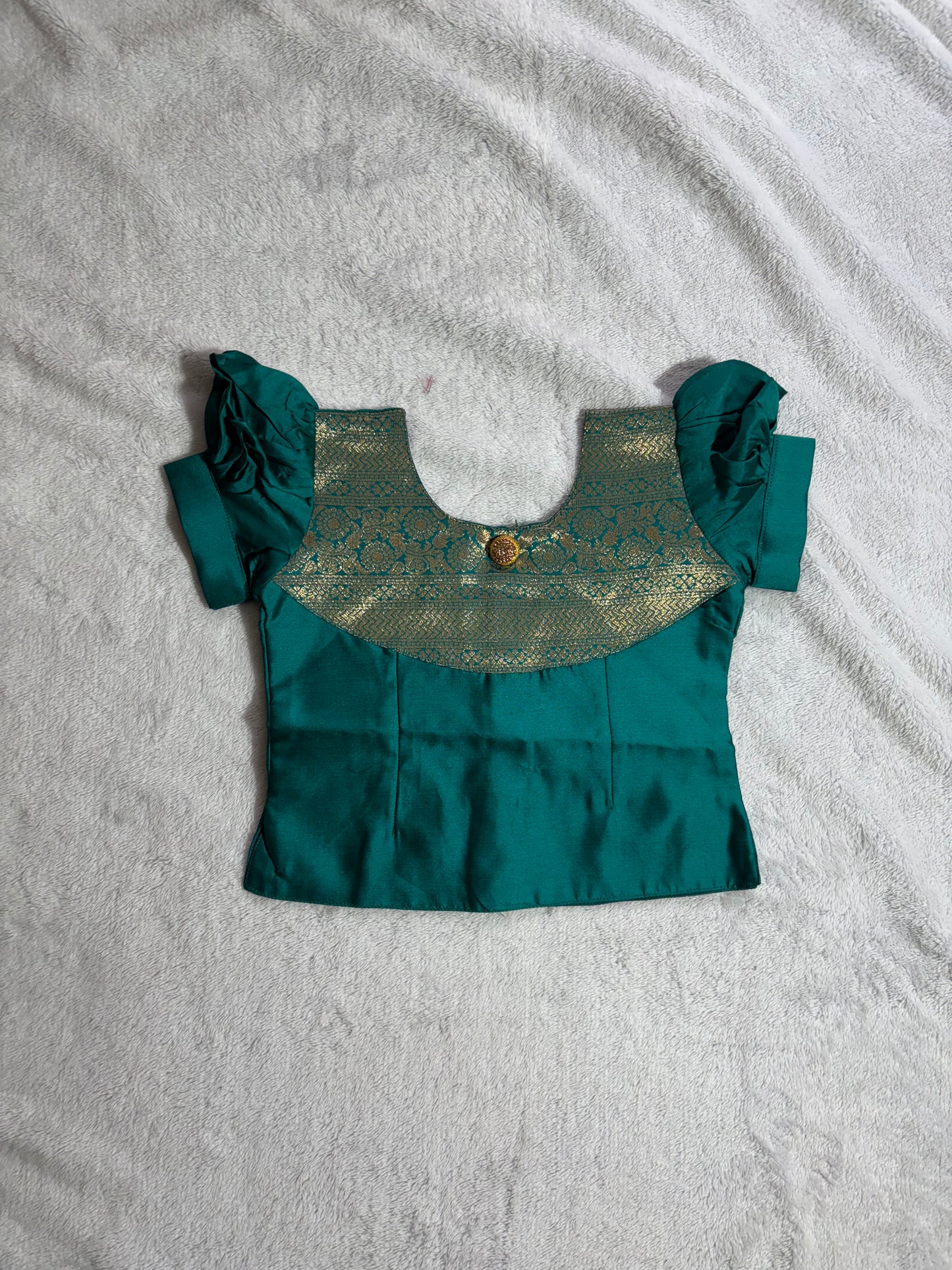 Dark green blouse with light peach lehenga pattu pavadai