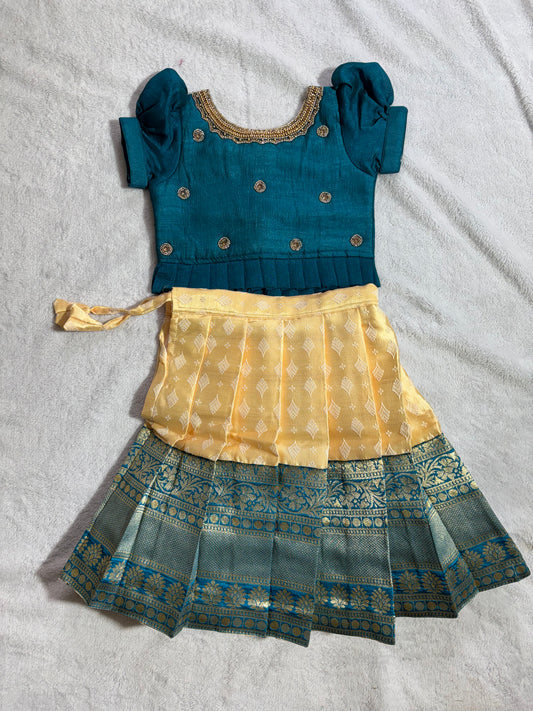 Yellow lehenga with green blouse with handmade aari work all over the blouse