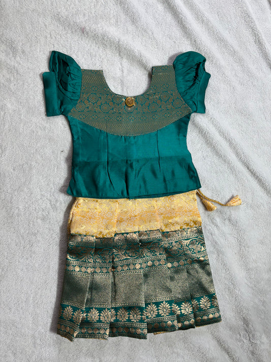Dark green blouse with yellow lehenga pattu pavadai
