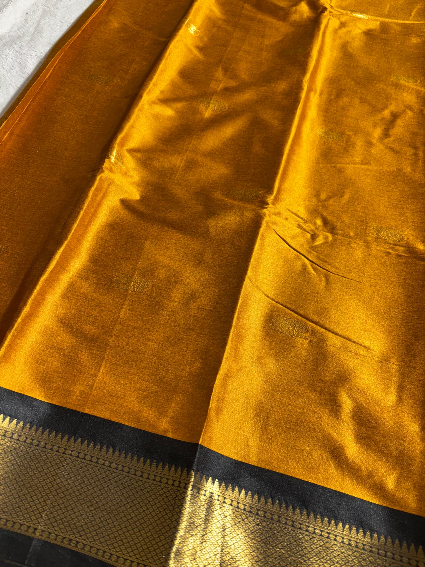 Mustard yellow with black silk cotton saree
