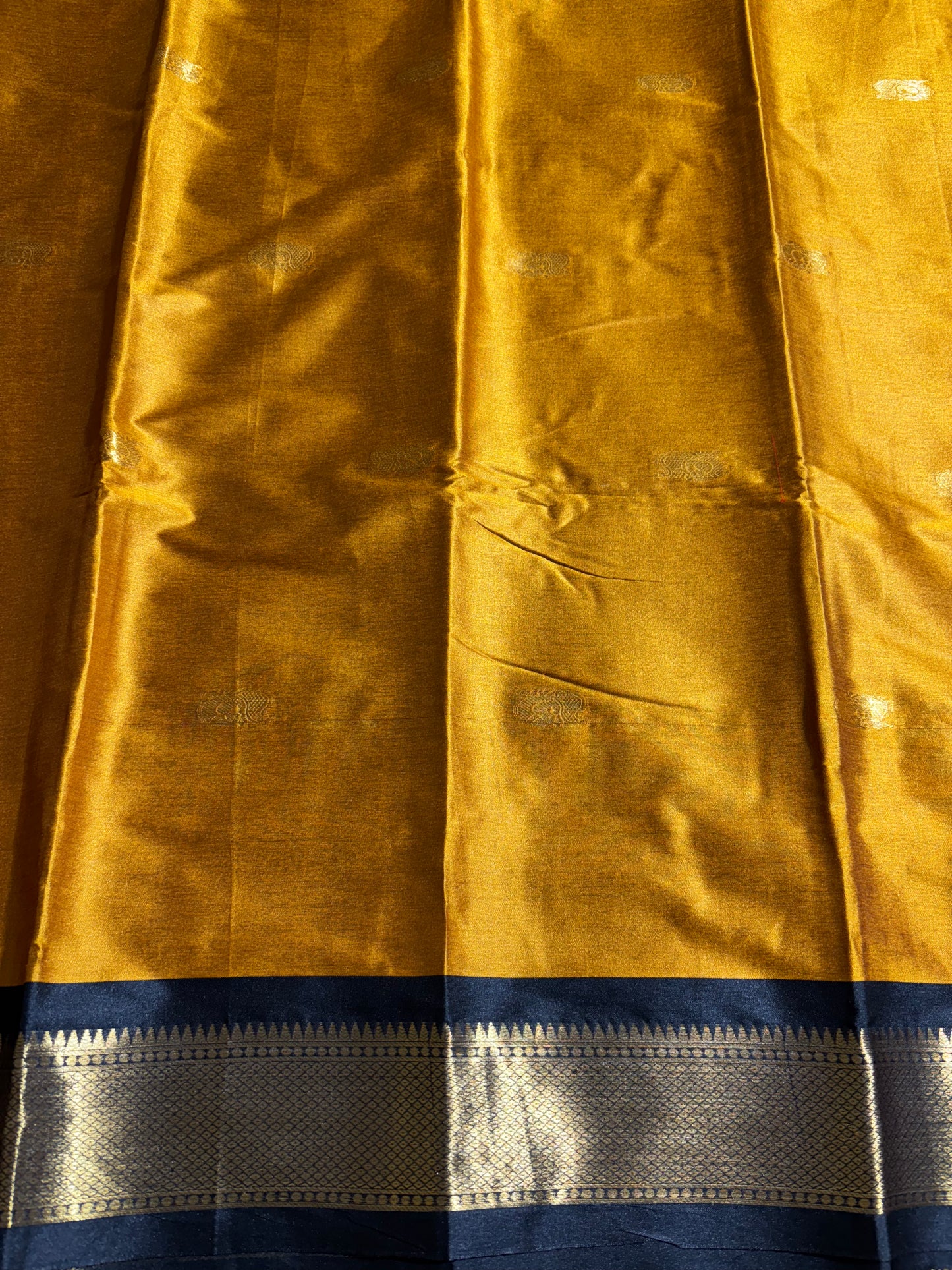 Mustard yellow with black silk cotton saree
