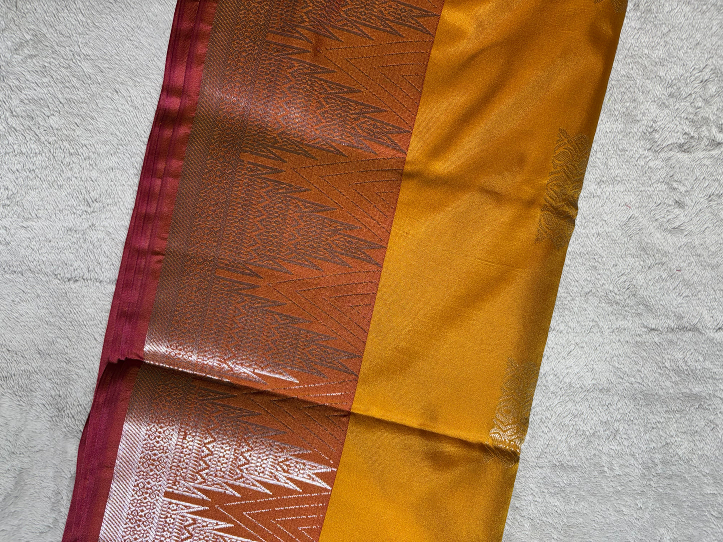 Mustard yellow with pink soft silk saree with temple border and tassels