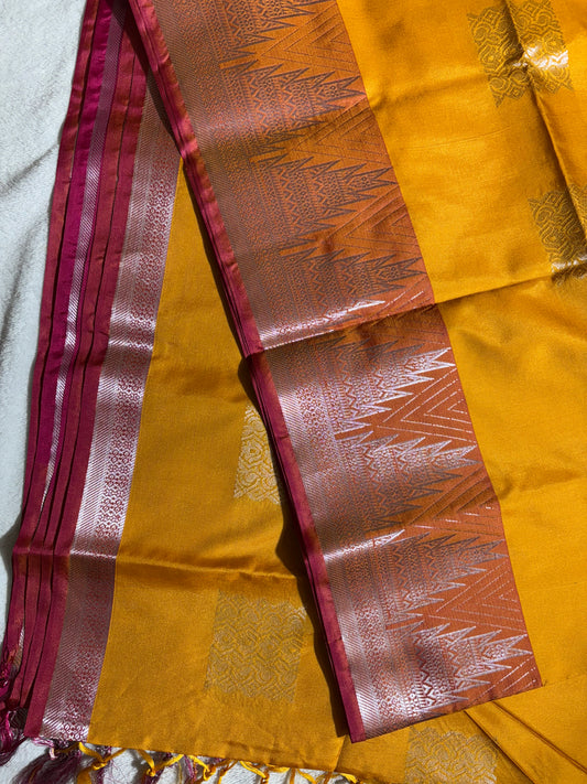 Mustard yellow with pink soft silk saree with temple border and tassels