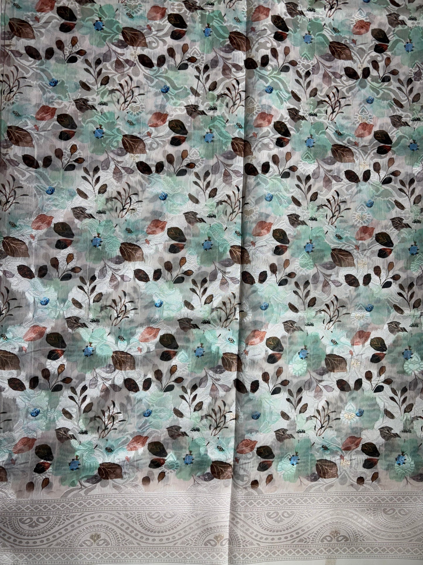 White cotton silk saree with Rama green floral print allover