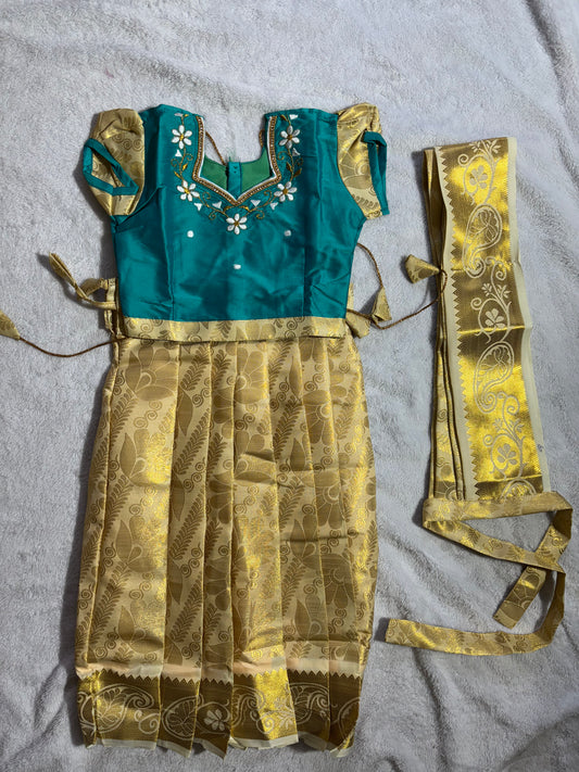 Rama green with a half white pattu pavadai with pleated waist belt